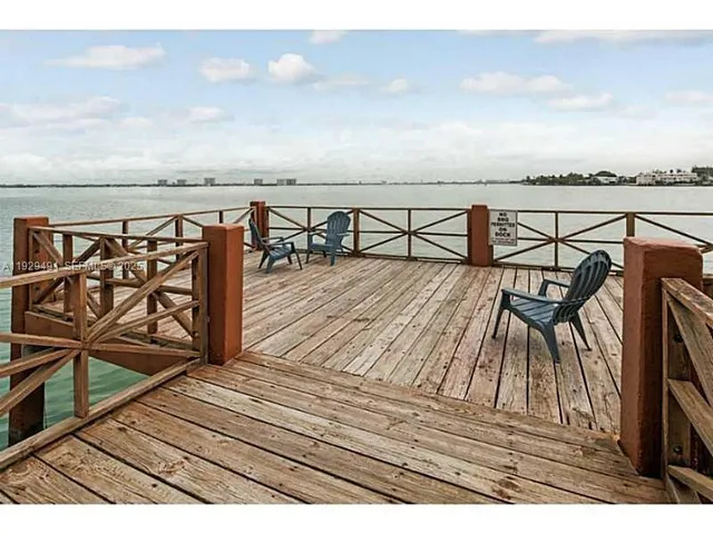 a view of a balcony with chairs