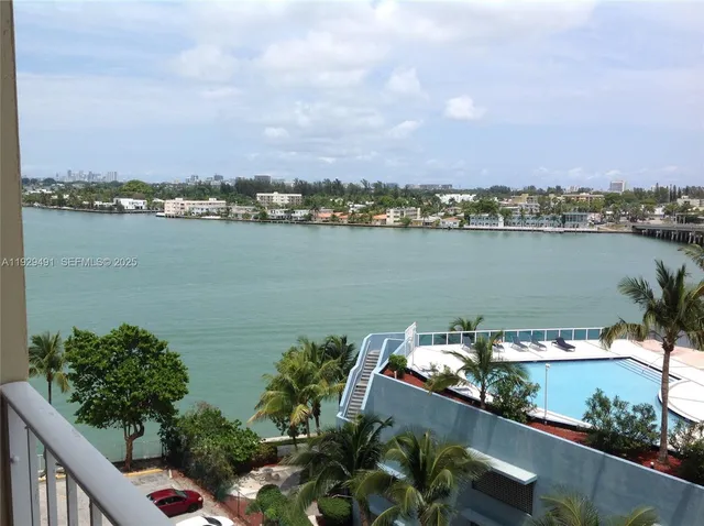a dining room with furniture and chandelier
