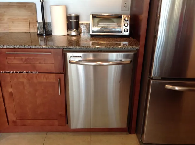 a view of a refrigerator in kitchen