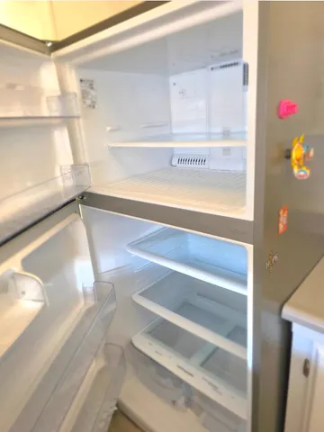 a view of walk in closet with an entryway