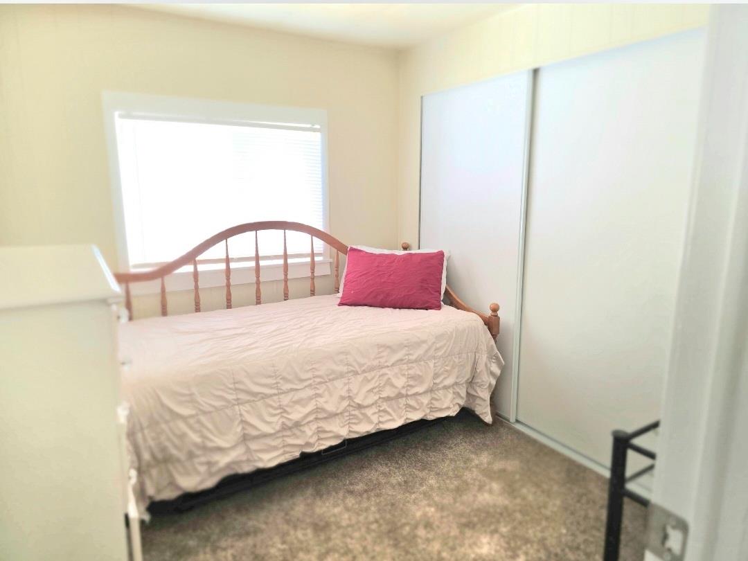 12344-26 Mile Road, Unit 32 Oakdale, CA 95219 - Photo 18 of 22 a bedroom with a bed and a window