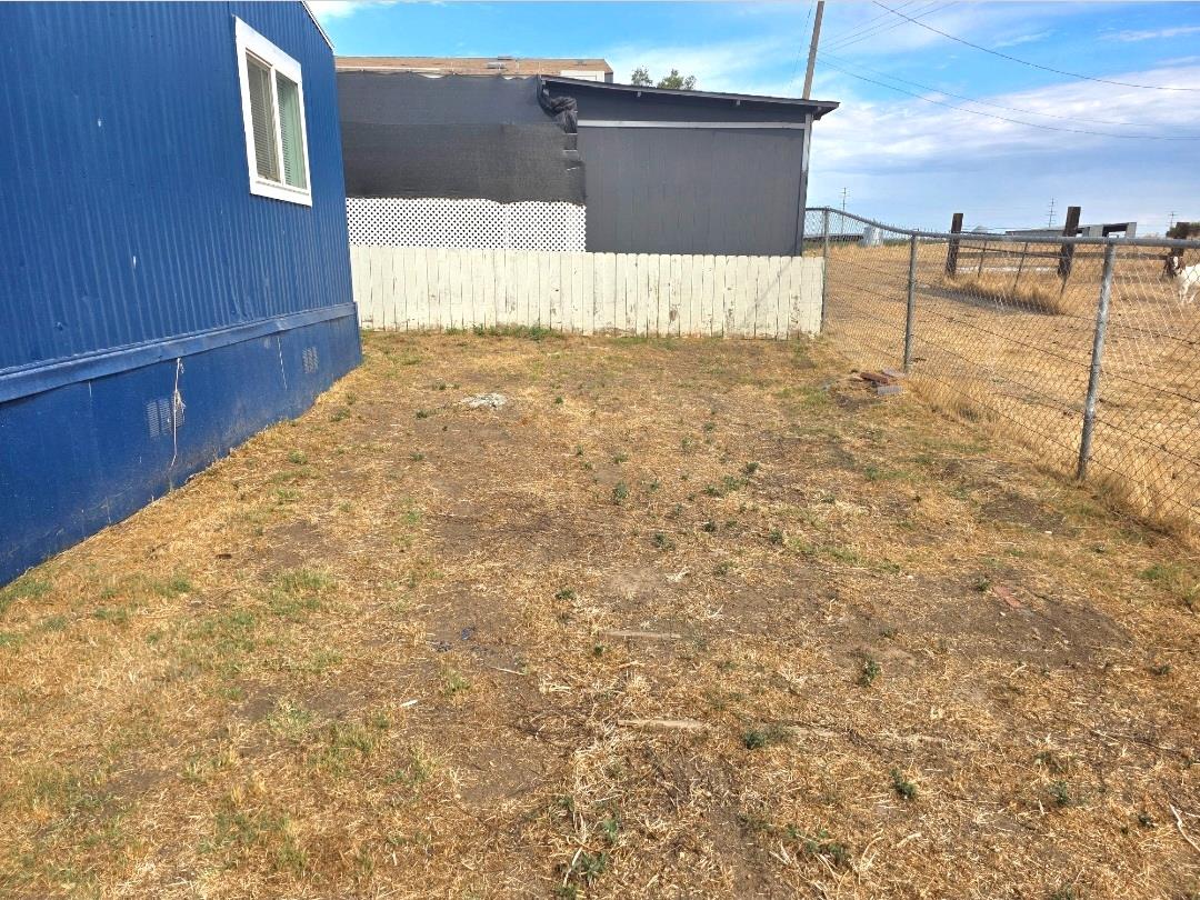 12344-26 Mile Road, Unit 32 Oakdale, CA 95219 - Photo 21 of 22 a view of a backyard