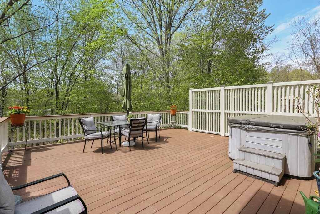 143 Kimball Road Amesbury, MA 01913 - Photo 27 of 30 a view of a deck with table and chairs and wooden floor