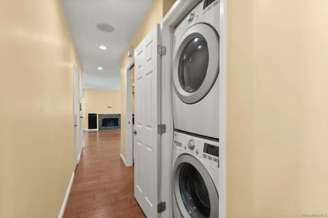 a view of a hallway with washer and dryer