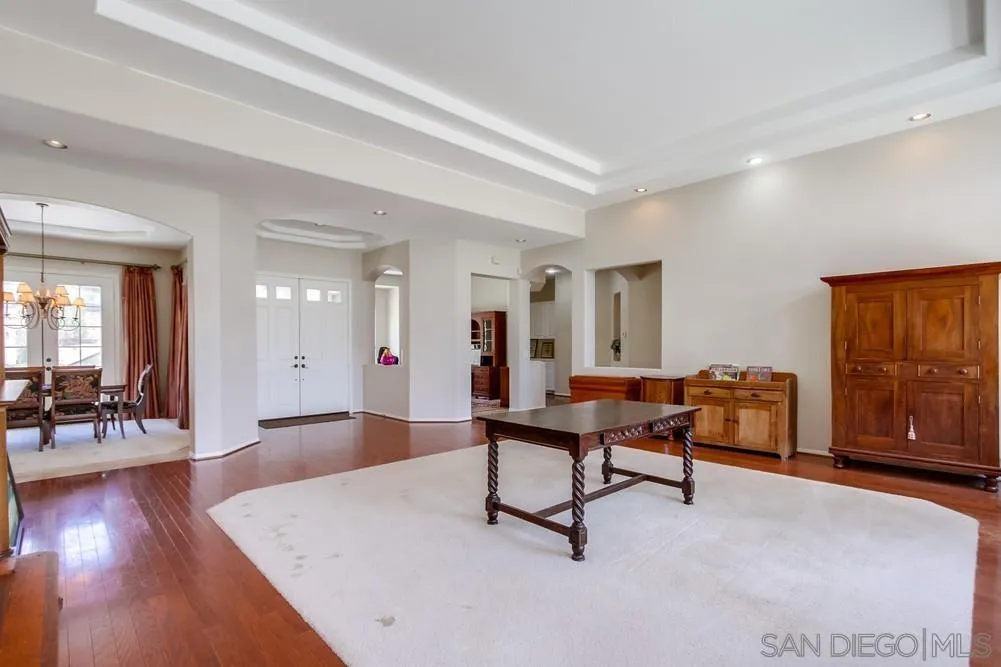3605-7 Logwood Place Fallbrook, CA 92028 - Photo 17 of 74 a living room with furniture a dining table and wooden floor