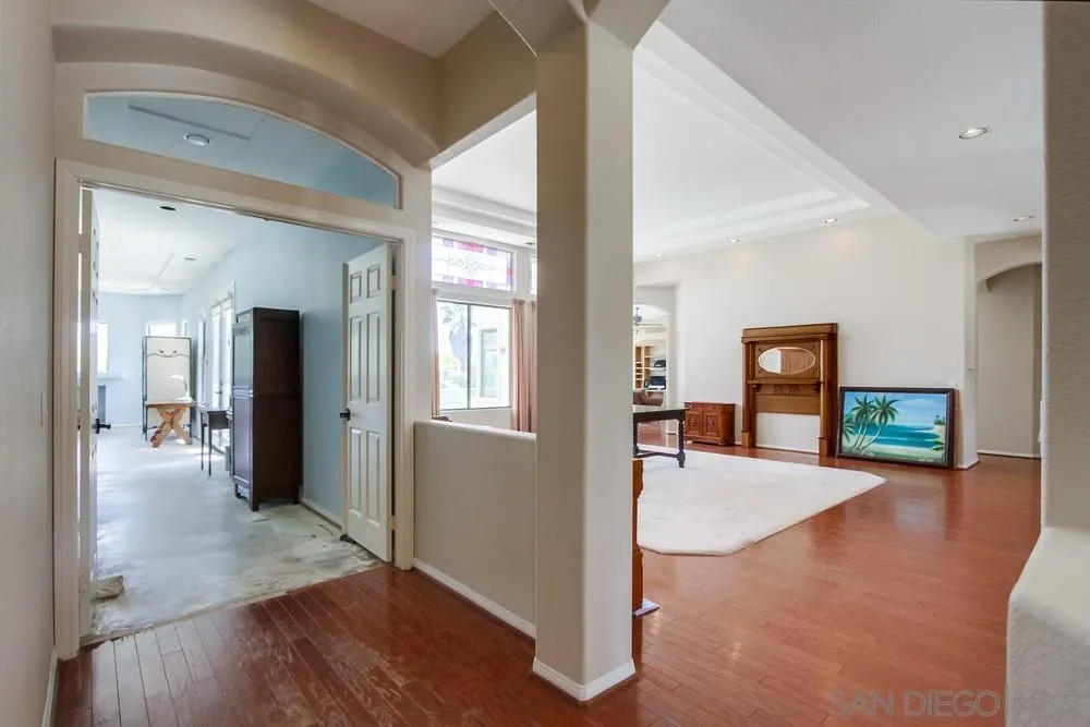 3605-7 Logwood Place Fallbrook, CA 92028 - Photo 23 of 74 a view of a livingroom with wooden floor and a flat screen tv