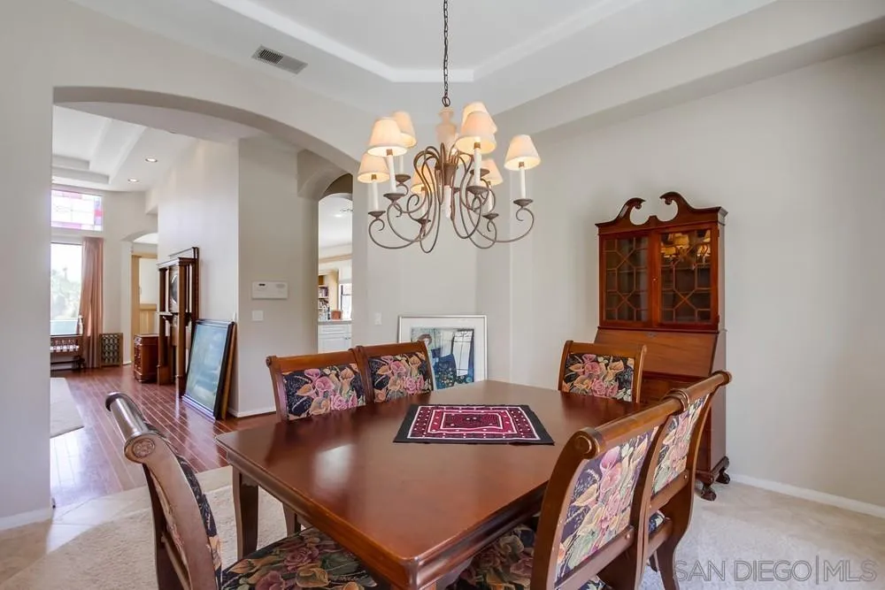 3605-7 Logwood Place Fallbrook, CA 92028 - Photo 27 of 74 a view of a dining room with furniture and chandelier