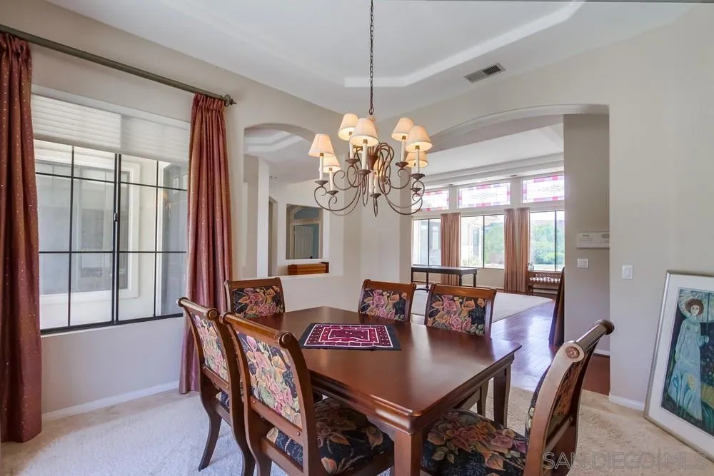 3605-7 Logwood Place Fallbrook, CA 92028 - Photo 28 of 74 a dining room with furniture a chandelier and window