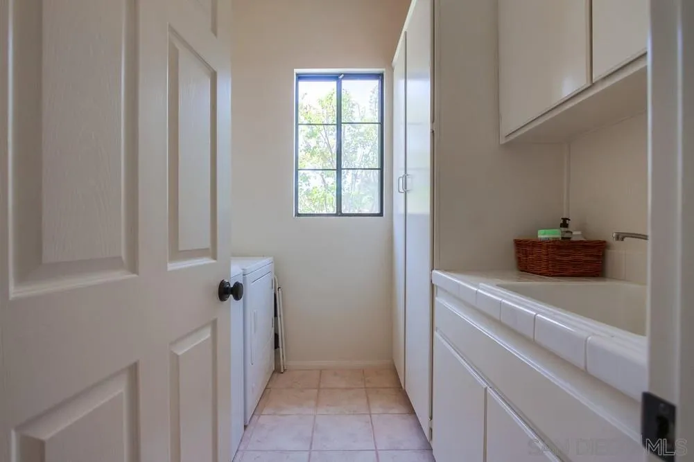 3605-7 Logwood Place Fallbrook, CA 92028 - Photo 32 of 74 a view of a kitchen from the hallway