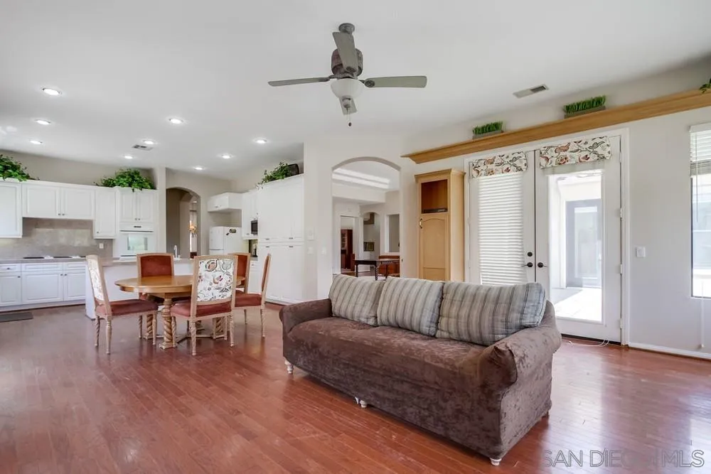 3605-7 Logwood Place Fallbrook, CA 92028 - Photo 44 of 74 a living room with furniture kitchen view and a wooden floor