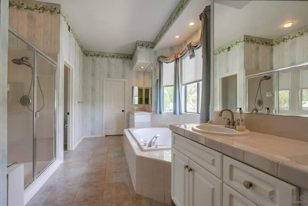 3605-7 Logwood Place Fallbrook, CA 92028 - Photo 54 of 74 a bathroom with a granite countertop sink mirror and double