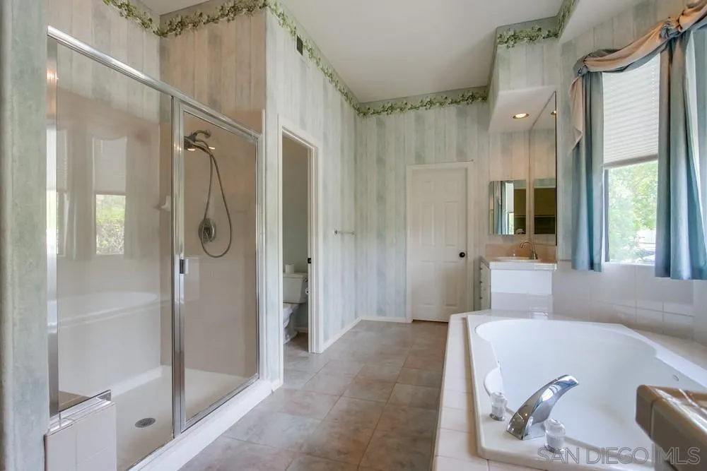 3605-7 Logwood Place Fallbrook, CA 92028 - Photo 55 of 74 a bathroom with a tub shower and sink