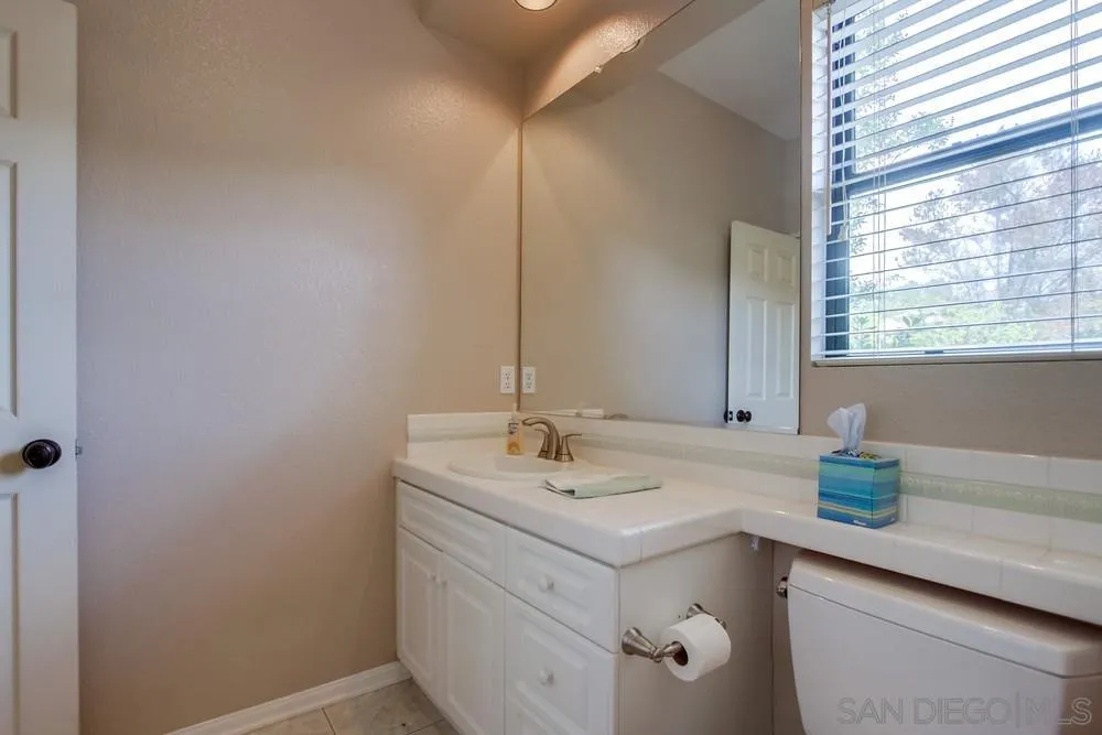 3605-7 Logwood Place Fallbrook, CA 92028 - Photo 62 of 74 a bathroom with a sink and a mirror