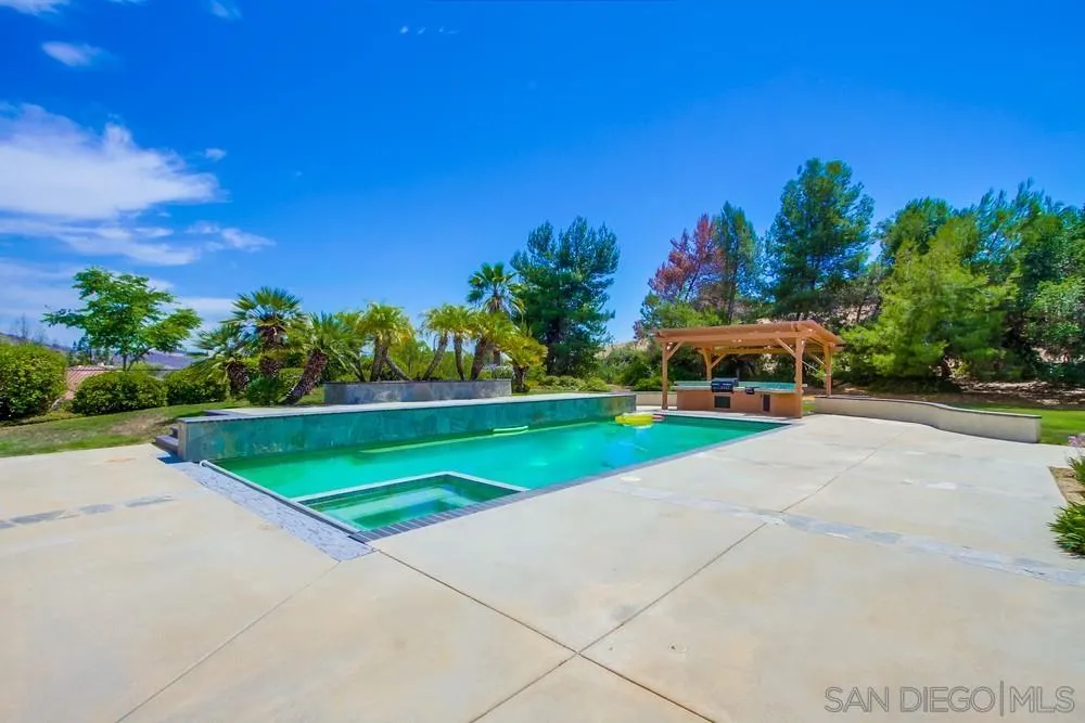 3605-7 Logwood Place Fallbrook, CA 92028 - Photo 67 of 74 a yellow and red house with a yard
