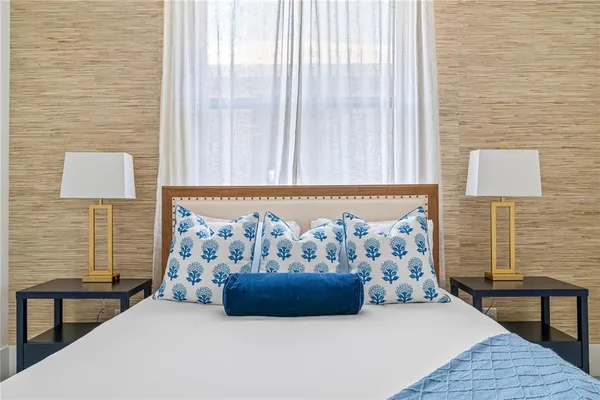 a bedroom with a bed and a couch