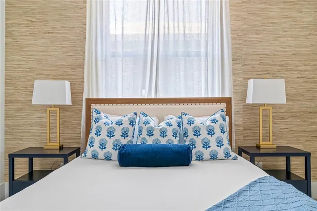 a bedroom with a bed and a couch