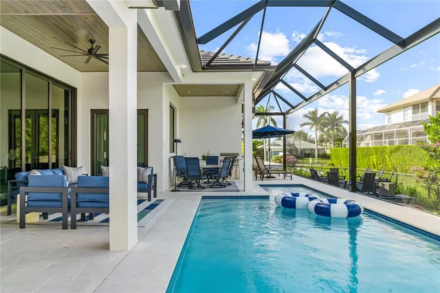 a view of swimming pool with outdoor seating