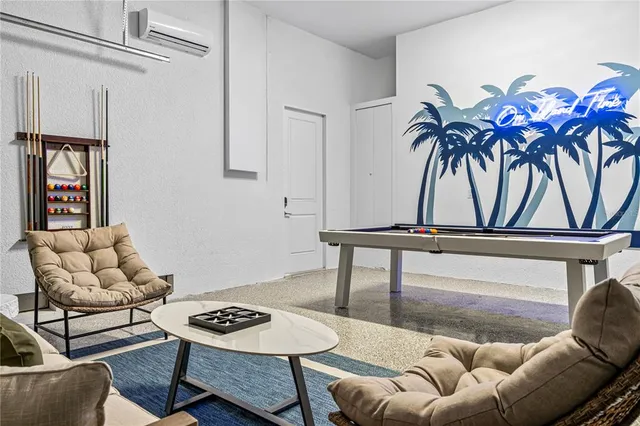 a living room with furniture and white walls