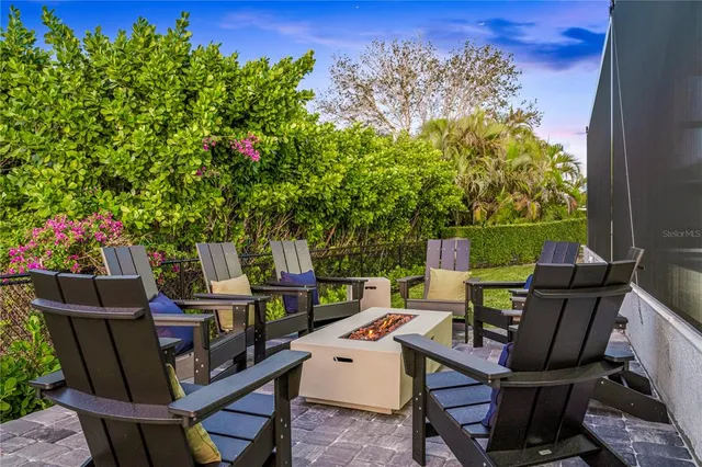 a view of a chairs and table in a patio