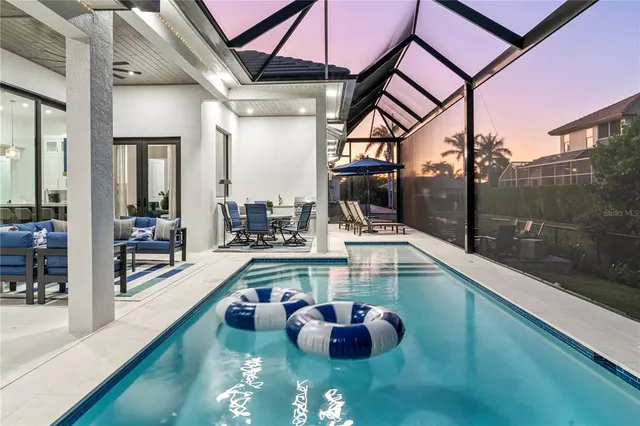 a view of a swimming pool with a patio