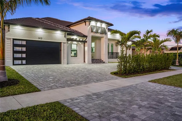 a large tree in front of a house