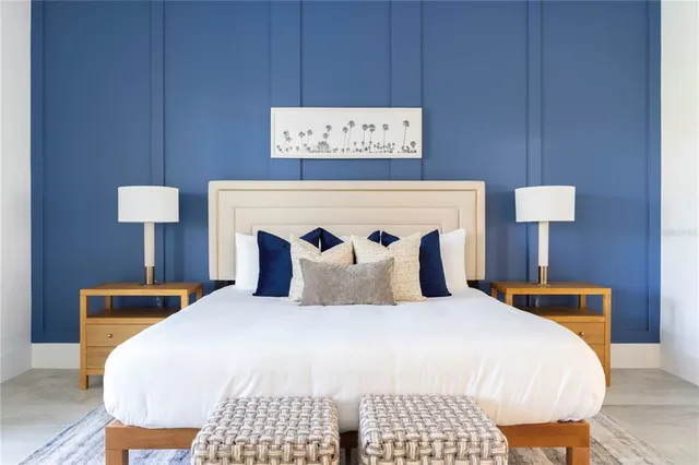 a bedroom with a bed and a night stand