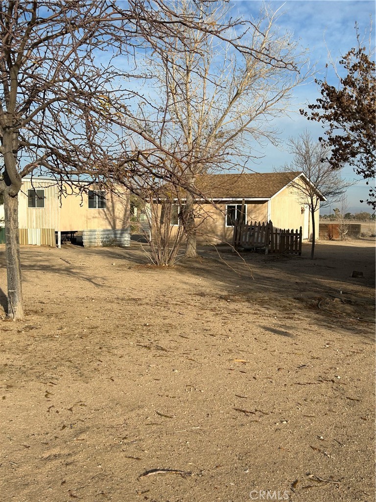 10550 Marrakesh Road Phelan, CA 92371 - Photo 1 of 1 a view of a yard with a house