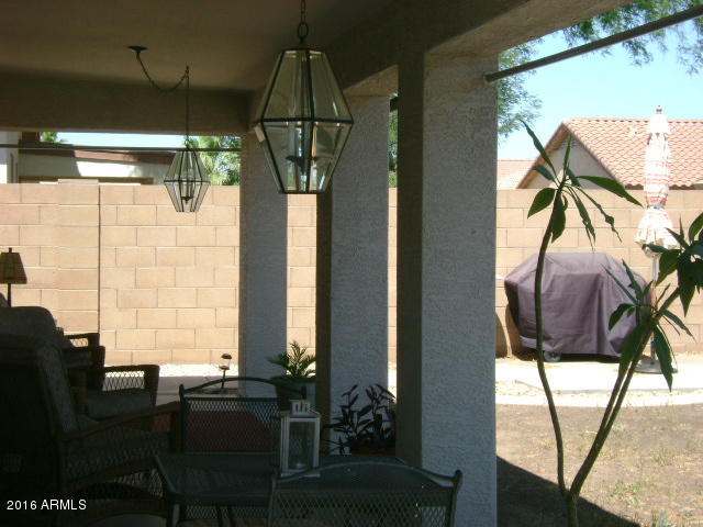 11174 West Berkeley Road Avondale, AZ 85392 - Photo 26 of 41 a front view of a house with wooden floor and windows