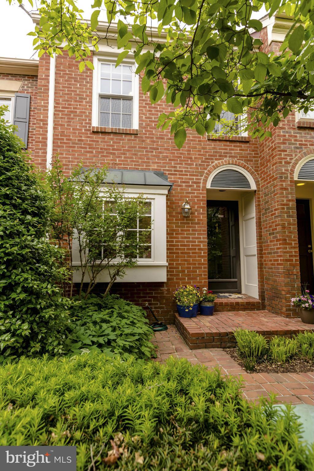 1233 Portner Road Alexandria, VA 22314 - Photo 2 of 29 a front view of a house with garden