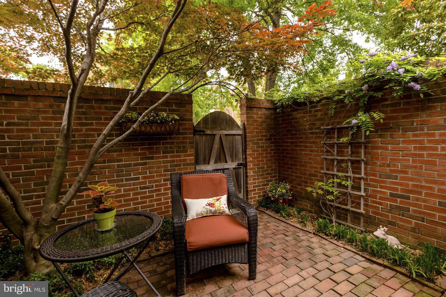 1233 Portner Road Alexandria, VA 22314 - Photo 15 of 29 a brick house with table and chairs