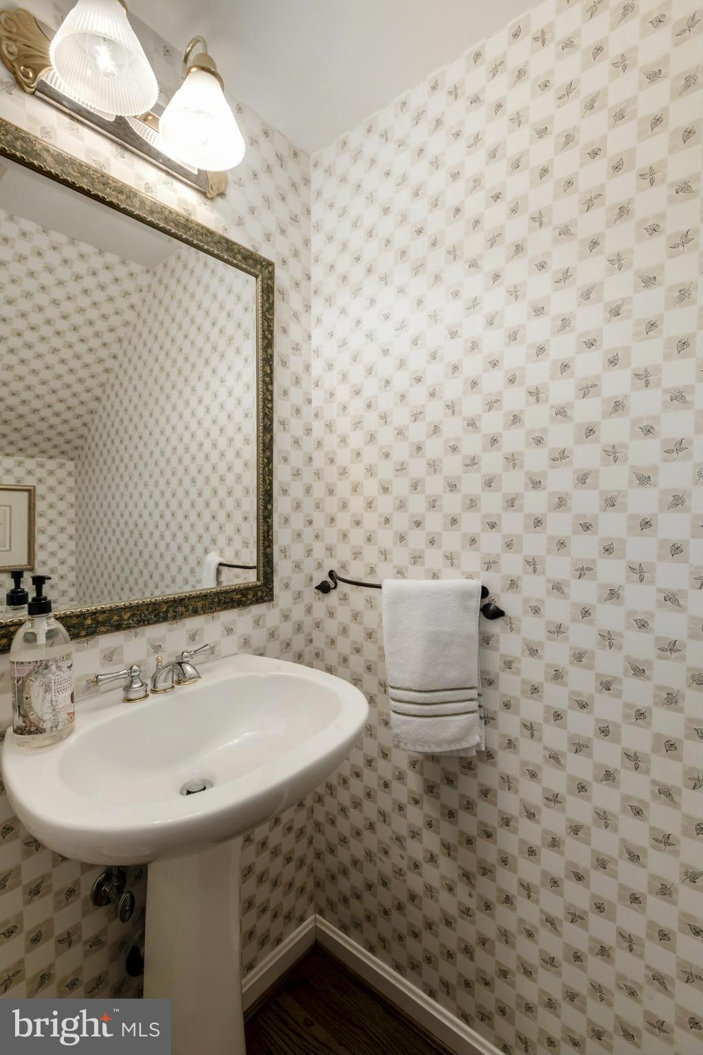 1233 Portner Road Alexandria, VA 22314 - Photo 18 of 29 a bathroom with a sink a toilet and a mirror