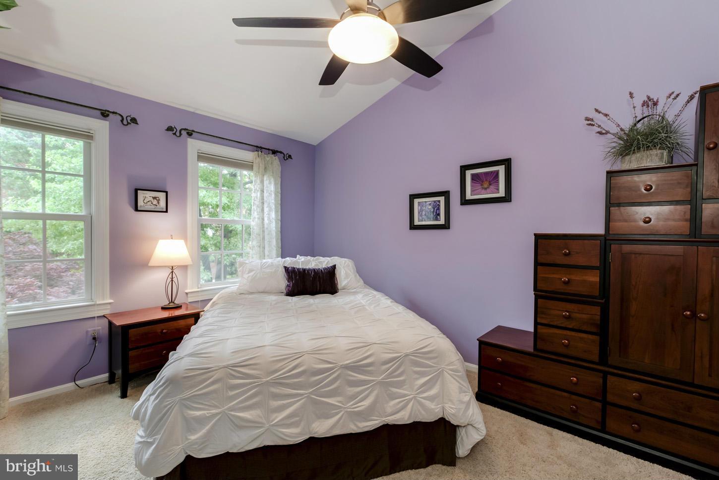 1233 Portner Road Alexandria, VA 22314 - Photo 20 of 29 a bedroom with a bed and a chandelier