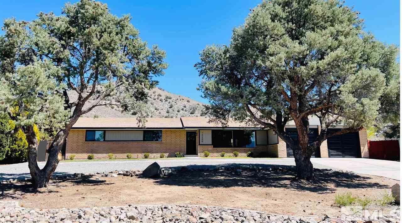 14200 Virginia Foothills Drive Reno, NV 89521 - Photo 1 of 1 a front view of a house with a yard