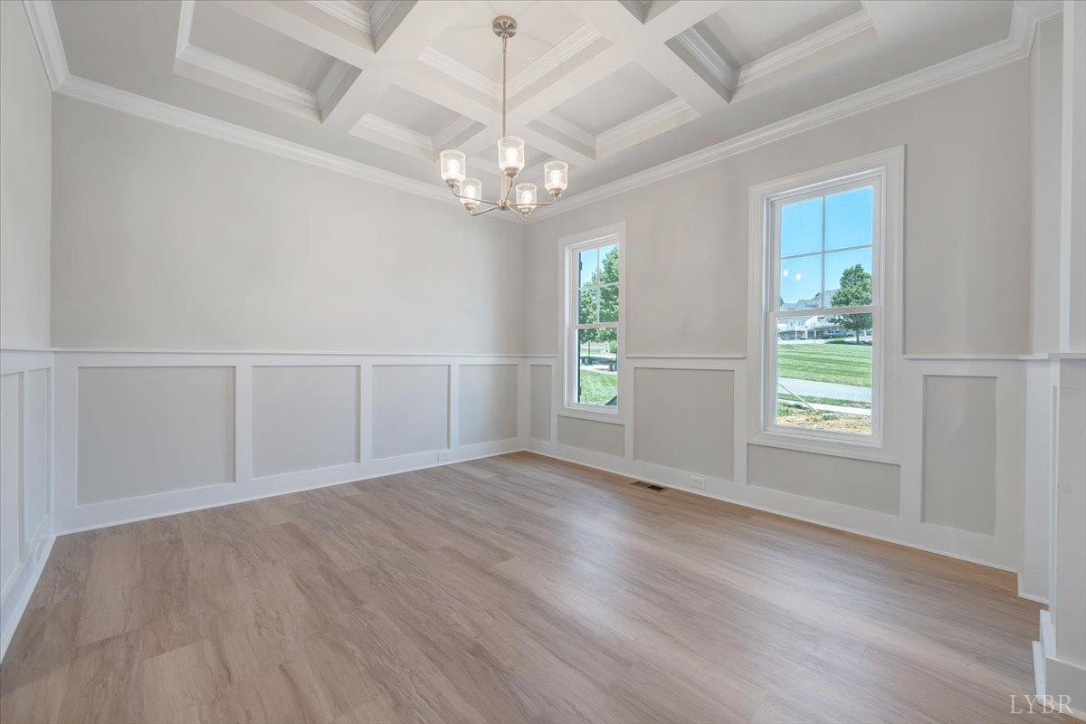 23 Elk Crk Road Forest, VA 24551 - Photo 3 of 22 an empty room with wooden floor chandelier and windows