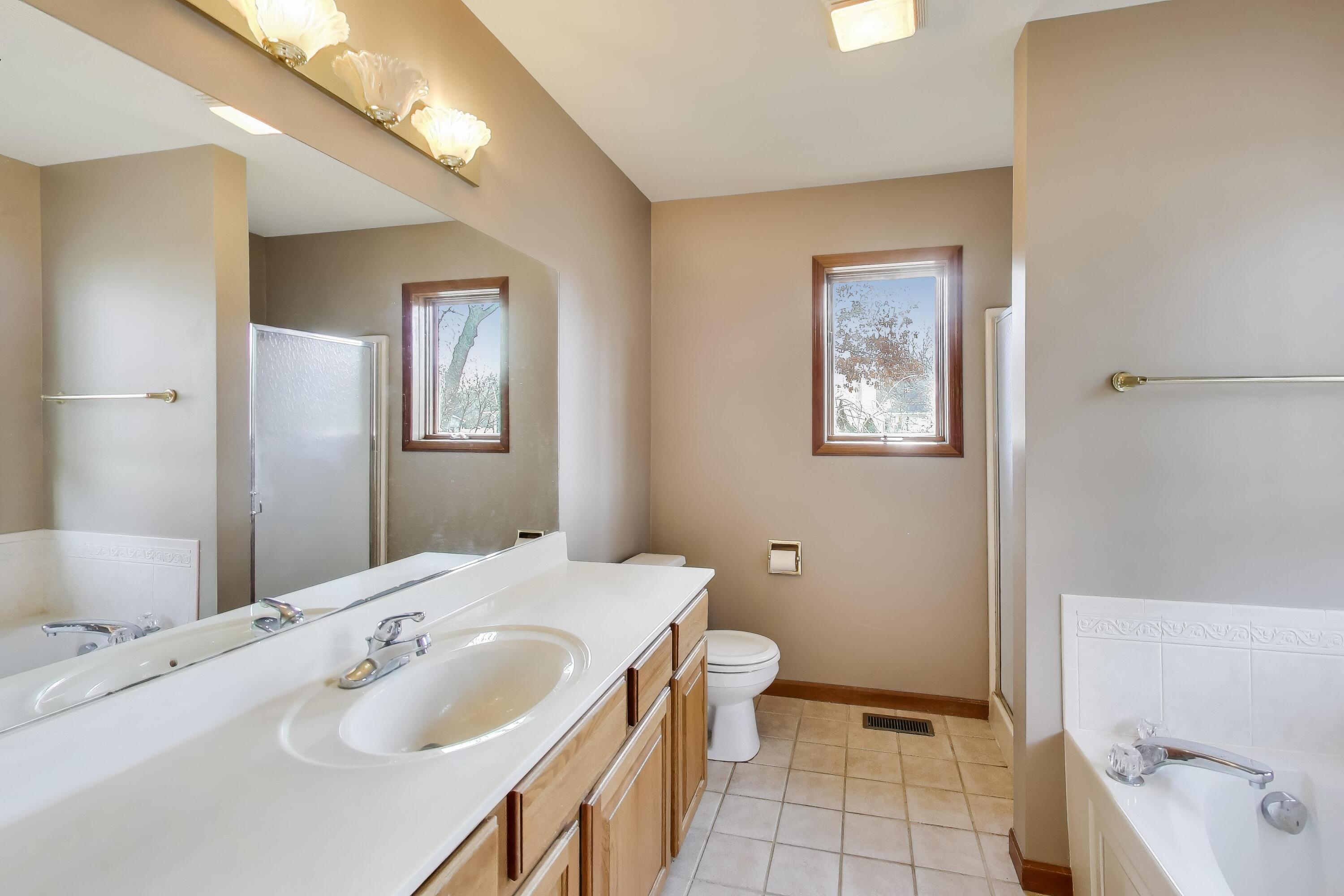 1642 Commodore Lane Chesterton, IN 46304 - Photo 16 of 34 a bathroom with a sink and a mirror