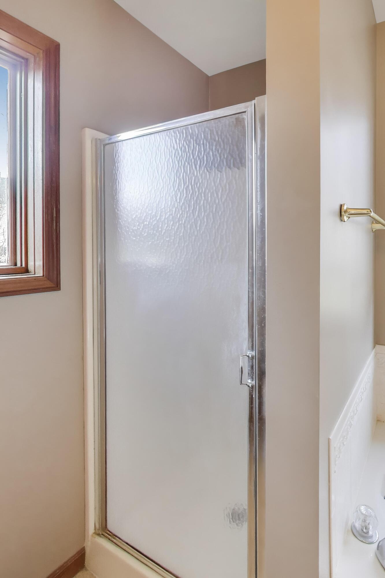 1642 Commodore Lane Chesterton, IN 46304 - Photo 18 of 34 a bathroom with a glass shower door