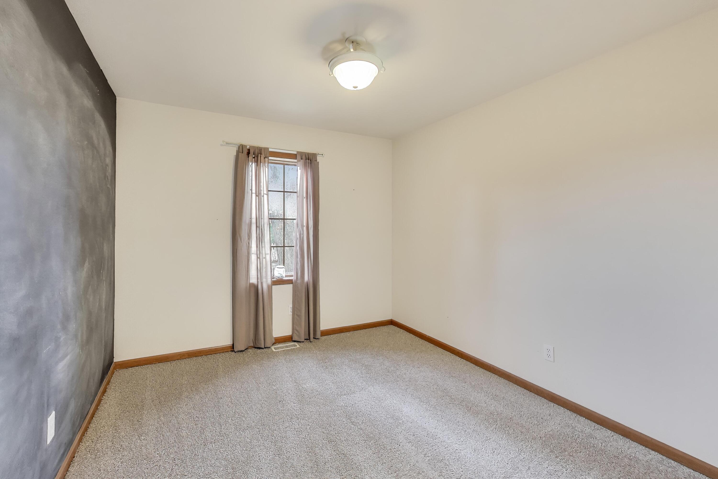 1642 Commodore Lane Chesterton, IN 46304 - Photo 21 of 34 an empty room with closet area and windows