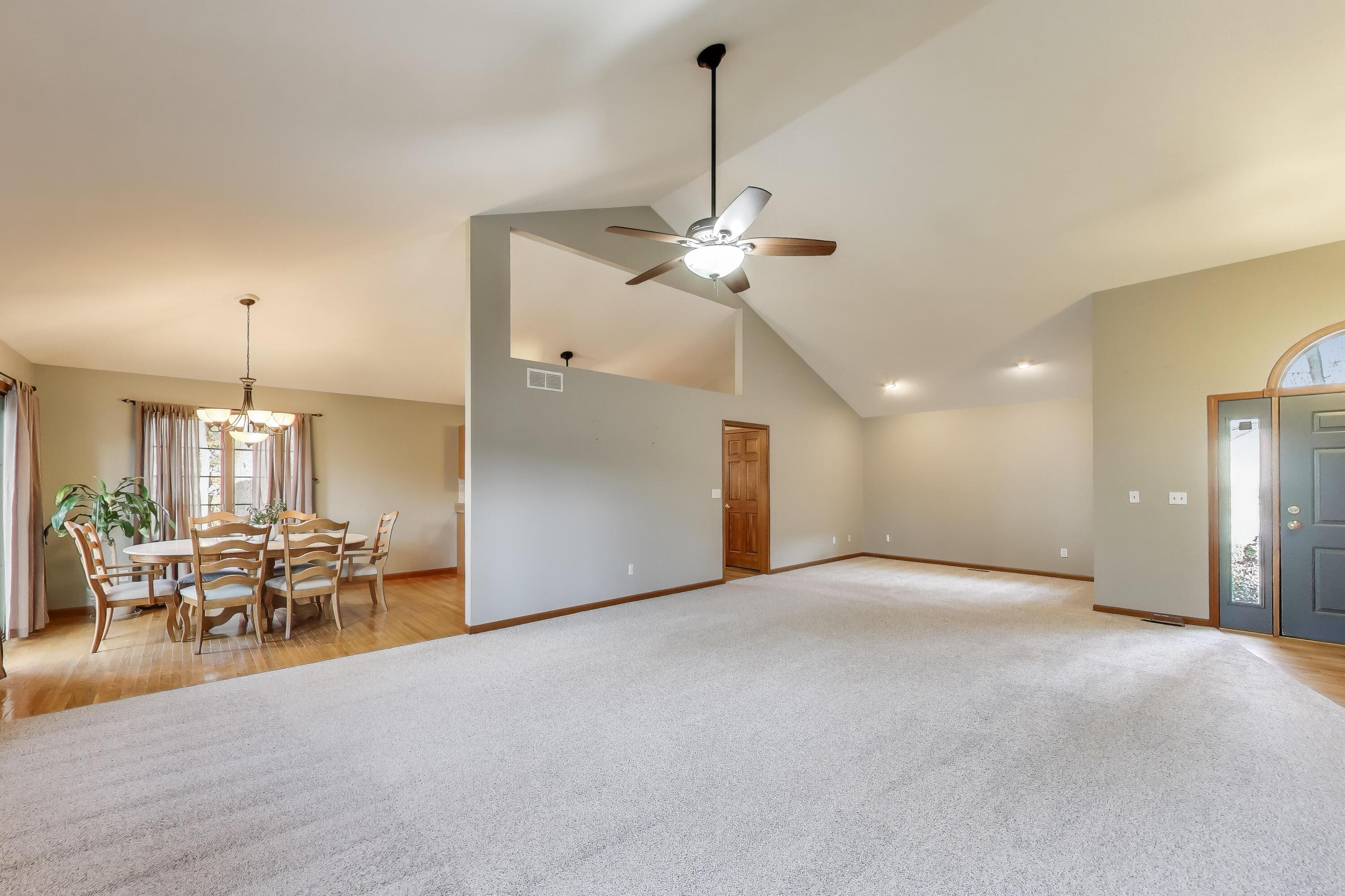 1642 Commodore Lane Chesterton, IN 46304 - Photo 6 of 34 a view of a livingroom with furniture and a ceiling fan