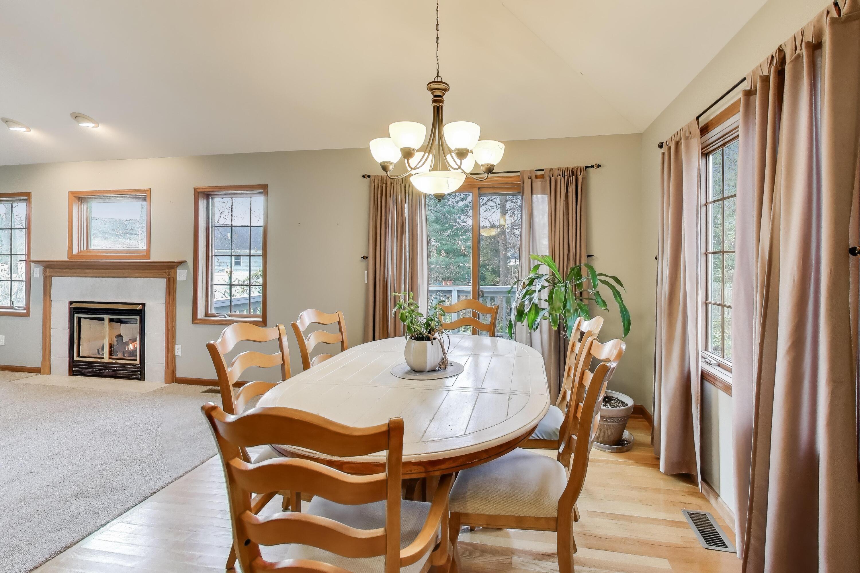 1642 Commodore Lane Chesterton, IN 46304 - Photo 8 of 34 a view of a dining room with furniture and a chandelier