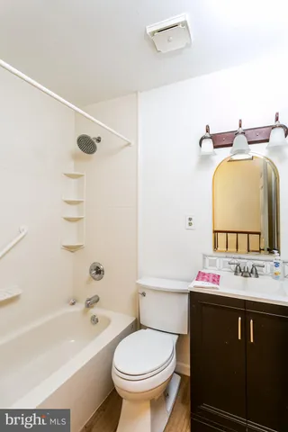 a bathroom with a sink a toilet and a bathtub