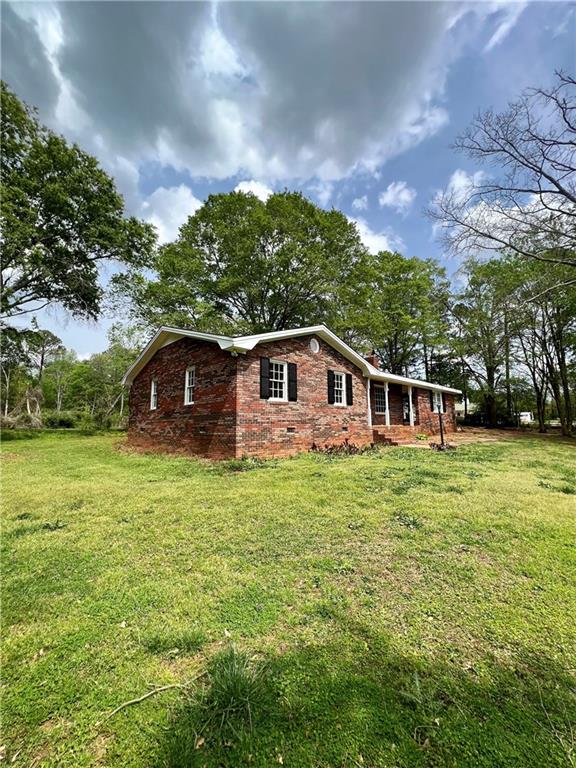 5940 Maysville Road Commerce, GA 30529 - Photo 1 of 1 a front view of a house with a yard