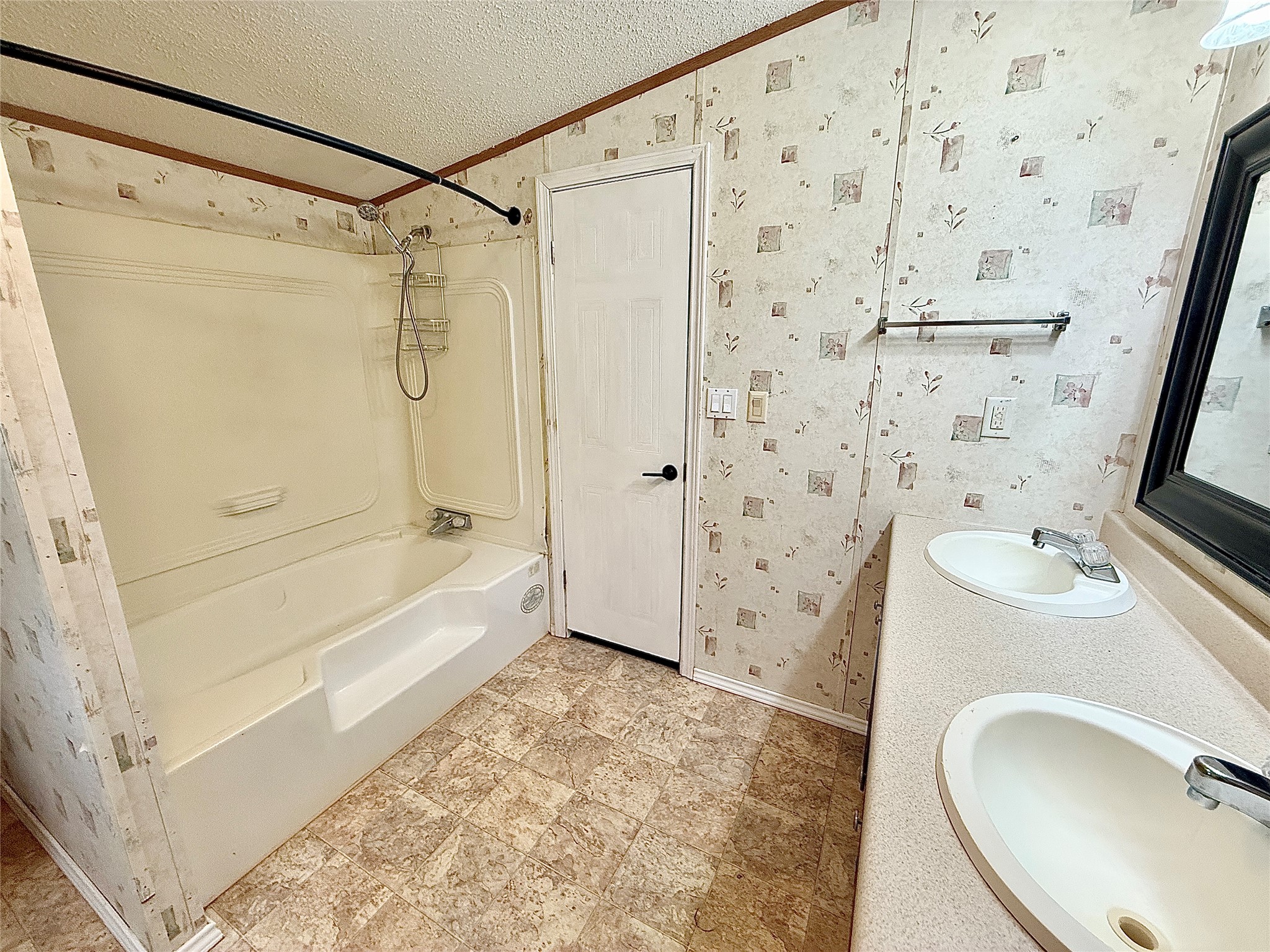 3075 FM 2001 Buda, TX 78610 - Photo 13 of 26 Twin vanities offer ample space in this practical bathroom featuring a combined tub and shower.
