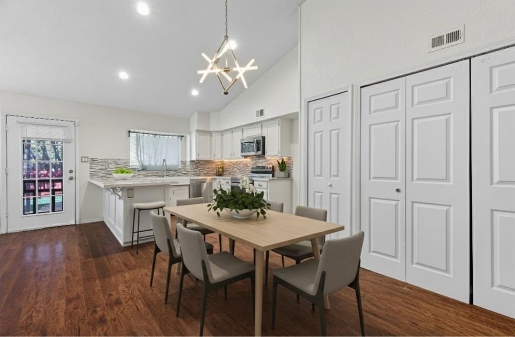 9101 Denver Street Rowlett, TX 75088 - Photo 12 of 40 a view of a dining room with furniture and wooden floor
