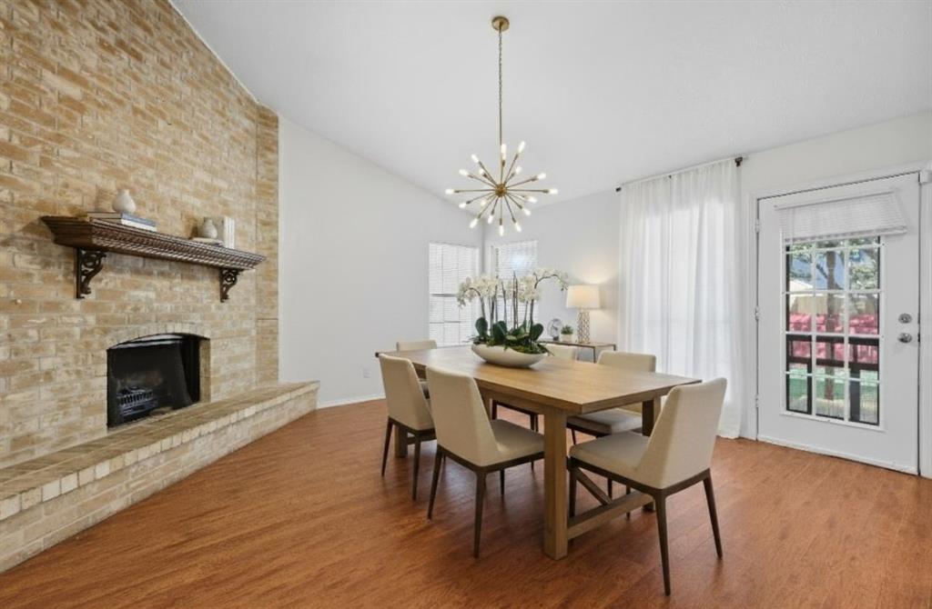 9101 Denver Street Rowlett, TX 75088 - Photo 19 of 40 a view of a dining room with furniture and wooden floor