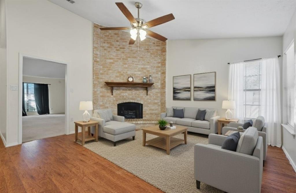 9101 Denver Street Rowlett, TX 75088 - Photo 20 of 40 a living room with furniture and a fireplace
