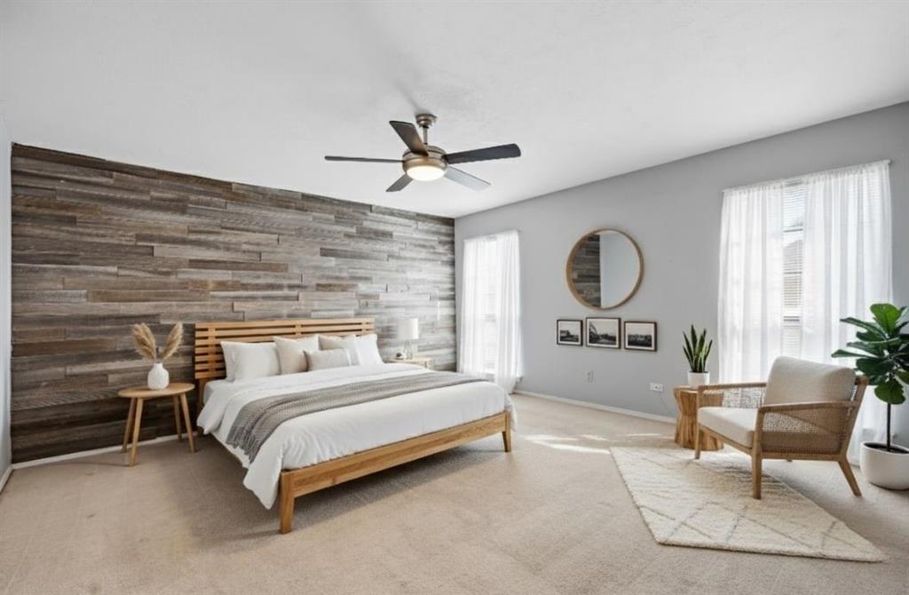 9101 Denver Street Rowlett, TX 75088 - Photo 23 of 40 a bedroom with a bed a mirror and furniture