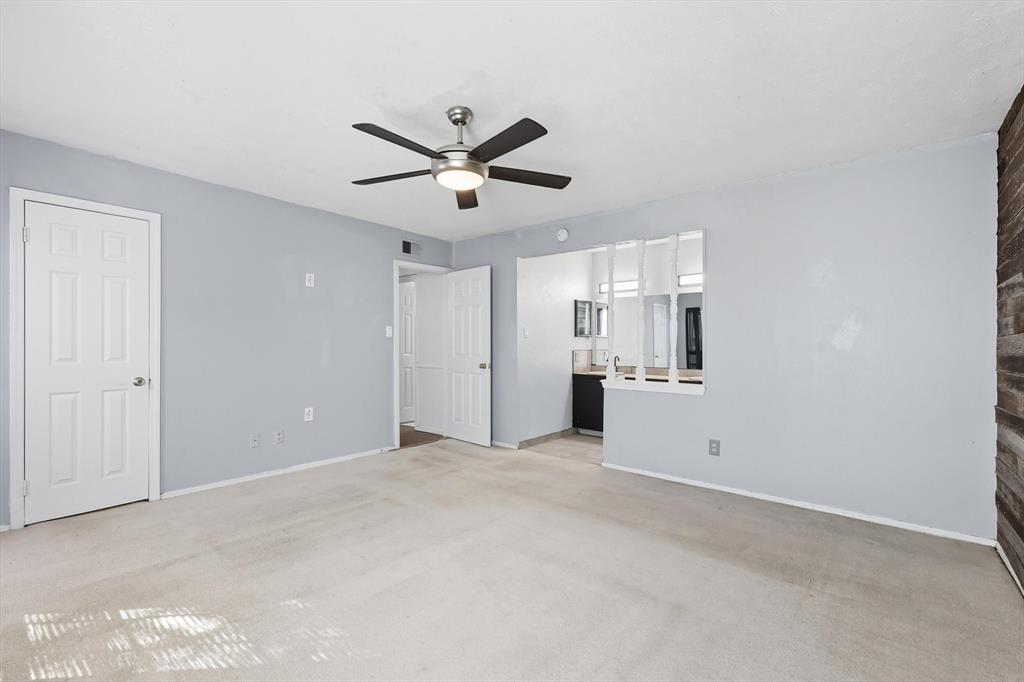 9101 Denver Street Rowlett, TX 75088 - Photo 24 of 40 a view of an empty room with a ceiling fan