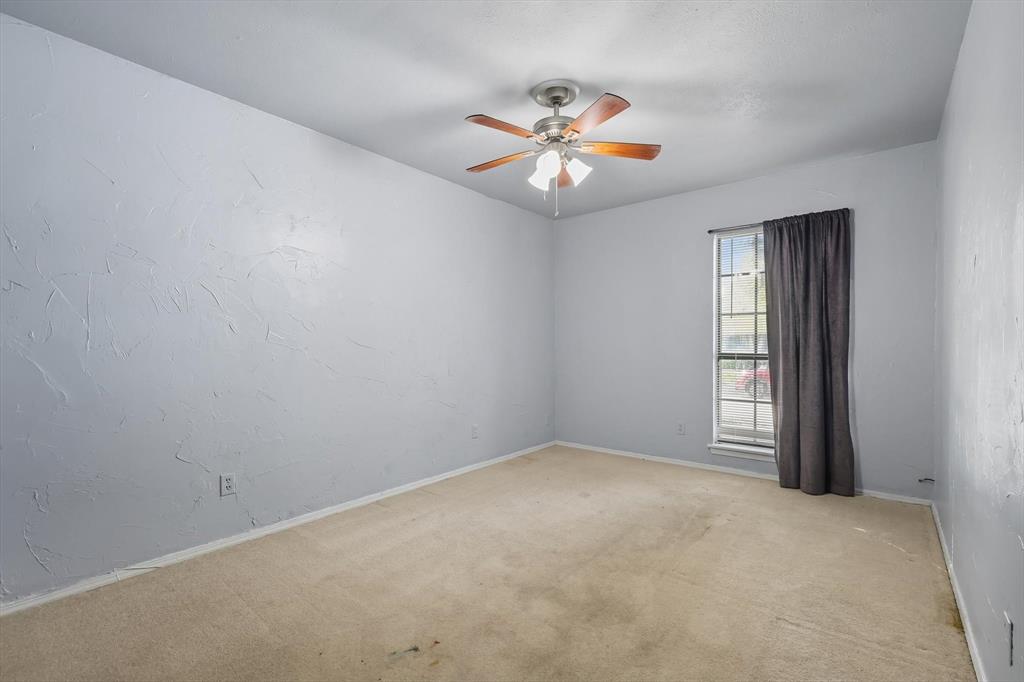 9101 Denver Street Rowlett, TX 75088 - Photo 27 of 40 an empty room with windows and fan
