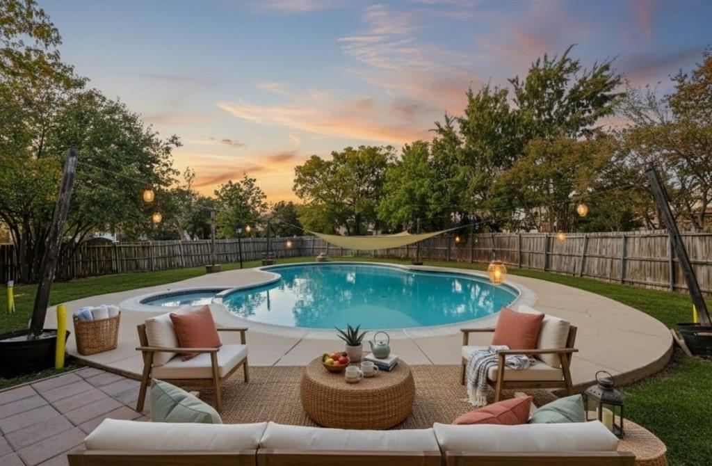 9101 Denver Street Rowlett, TX 75088 - Photo 36 of 40 a view of a lake with couches and pool