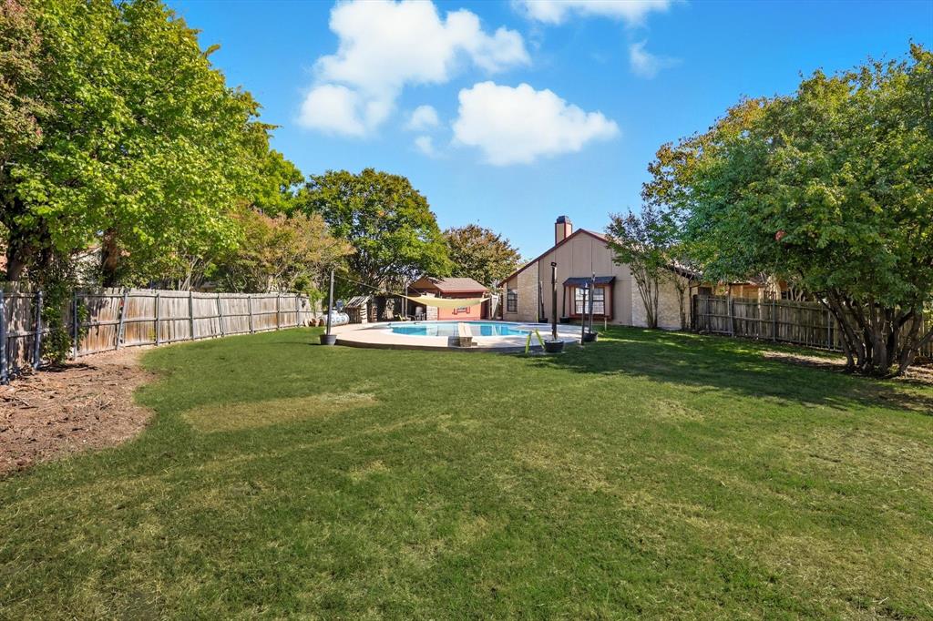9101 Denver Street Rowlett, TX 75088 - Photo 37 of 40 a front view of house with yard and green space